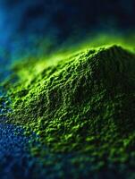 Moringa powder displayed on a textured surface in vibrant colors photo