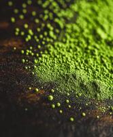 Moringa powder scattered on a wooden surface for natural health photo