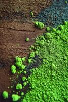 Moringa powder spread across a wooden surface in natural light photo