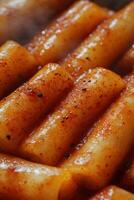 Delicious tteokbokki served hot with a spicy sauce and aroma photo