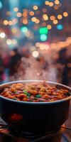 Steam rises from a pot of tteokbokki at a vibrant street market photo