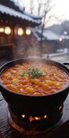 Savory tteokbokki simmering in a traditional pot in winter photo