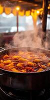 Freshly cooked tteokbokki with steam rising in a street market photo