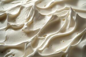 Soft cheese with a creamy texture displayed on a surface photo