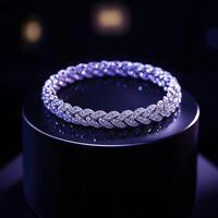 Elegant diamond bracelet displayed on sleek pedestal in dim light photo