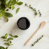 Herbal beauty products on marble background photo