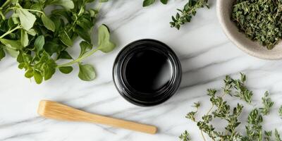 Shilajit resin surrounded by fresh herbs on a marble backdrop photo
