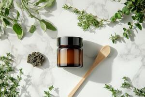 Shilajit in natural setting with herbs and wooden spoon photo