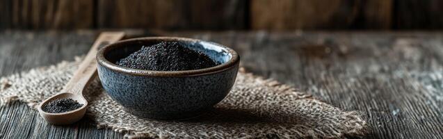 Black tea in a cup on a wooden table photo