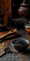 Shilajit resin in a rustic setting with wooden utensils photo