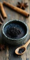 Natural shilajit in a bowl with wooden spoon and spices nearby photo