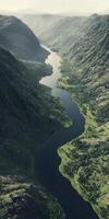 Serene river flowing through lush valley in tranquil landscape photo