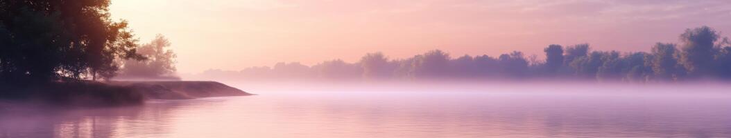 Serene river waters at dawn with mist and soft colors photo