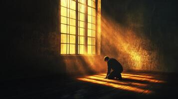Light streams through the window as a figure kneels in reflection photo