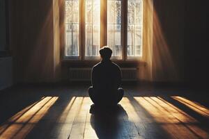 Contemplation in a sunlit room during quiet morning hours photo