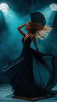Elegant dancer performs in dramatic lighting during a night event photo