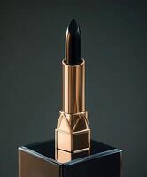 Luxurious black lipstick in elegant packaging displayed on a counter photo