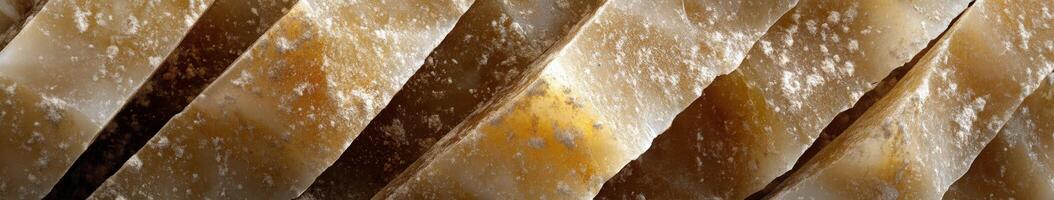 Parmesan cheese blocks arranged in a decorative pattern showcasing rich texture and aged flavor photo