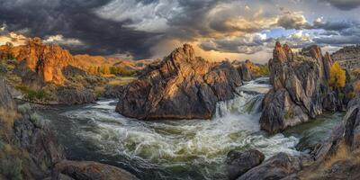 A river flows through a rocky canyon under a stormy sky photo