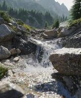 Mountain river cascading through rocky landscape with lush greenery under sunlight photo