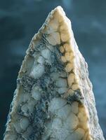 Unique blue cheese texture resembling natural stone formation with intricate patterns and colors photo
