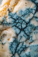 Exploring the intricate texture of blue cheese showcasing its unique blue marbling patterns photo