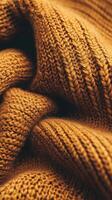 Luxurious boucle fabric in warm golden hues showcases intricate knit patterns ideal for cozy apparel or home decor projects photo