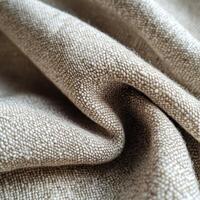 Boucle fabric showcases intricate texture and soft appearance in natural tones photo