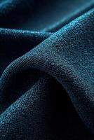 Beautiful boucle fabric texture in rich teal color showcasing intricate weave and soft drape for elegant design possibilities photo