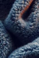 Soft boucle fabric showcasing texture and intricate patterns in rich blue tones for cozy garment design photo