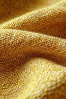 Beautiful close-up of vibrant yellow boucle fabric showcasing its unique texture and rich color photo