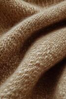 Soft and textured boucle fabric showcasing rich tones and intricate weave patterns for textile enthusiasts photo