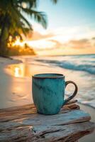 Enjoying a warm drink at sunset on a tranquil beach with gentle waves lapping the shore photo