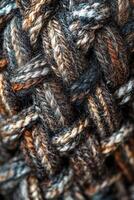 Close-up view of intricately woven fabric showcasing rich textures and colors in a crafting workspace photo