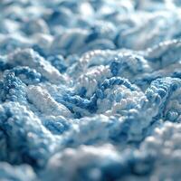 Boucle fabric texture showcasing intricate patterns in soft blue tones and a cozy feel for home decor projects photo