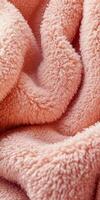 Soft boucle fabric texture in warm peach color drapes elegantly on a cozy setting for interior design inspiration photo