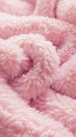 Boucle fabric texture showcasing soft, fluffy pink material for cozy textile applications photo