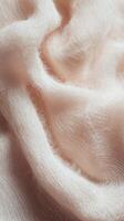 Boucle fabric texture showcases soft, inviting fibers in delicate hues perfect for cozy clothing and home decor photo