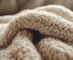 Boucle fabric texture showcasing intricate patterns and softness in warm beige tones photo