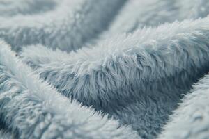 Soft and luxurious boucle fabric texture showcasing its distinctive weave and plush feel in serene blue tones photo