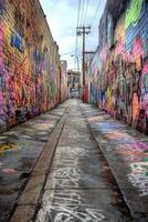 Vibrant graffiti alley showcasing colorful street art in an urban setting on a cloudy day photo