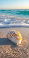 Beautiful spiral seashell resting on sandy beach with gentle ocean waves lapping at the shore during sunset photo
