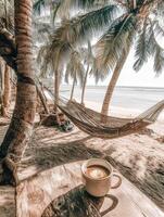 Enjoying a relaxing coffee moment on a tropical beach with swaying palm trees and a hammock photo