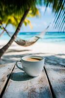 Enjoying coffee in a serene beach setting with a hammock and palm trees on a sunny day photo