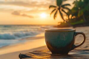 Enjoying a warm cup of coffee by the beach at sunrise with golden waves and palm trees in the background photo
