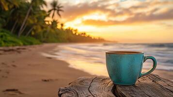 Enjoying a warm beverage by the beach at sunrise with palm trees framing the horizon photo