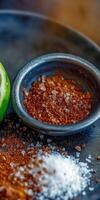 Delicious Tajin seasoning served with lime for enhancing flavors of fruits and snacks photo