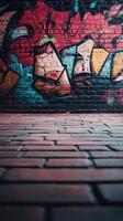 A brick wall with graffiti on it and a brick floor photo