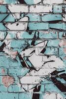 Colorful graffiti on a textured brick wall in an urban setting photo
