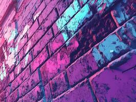 Vibrant street art on brick wall at urban location during daylight photo
